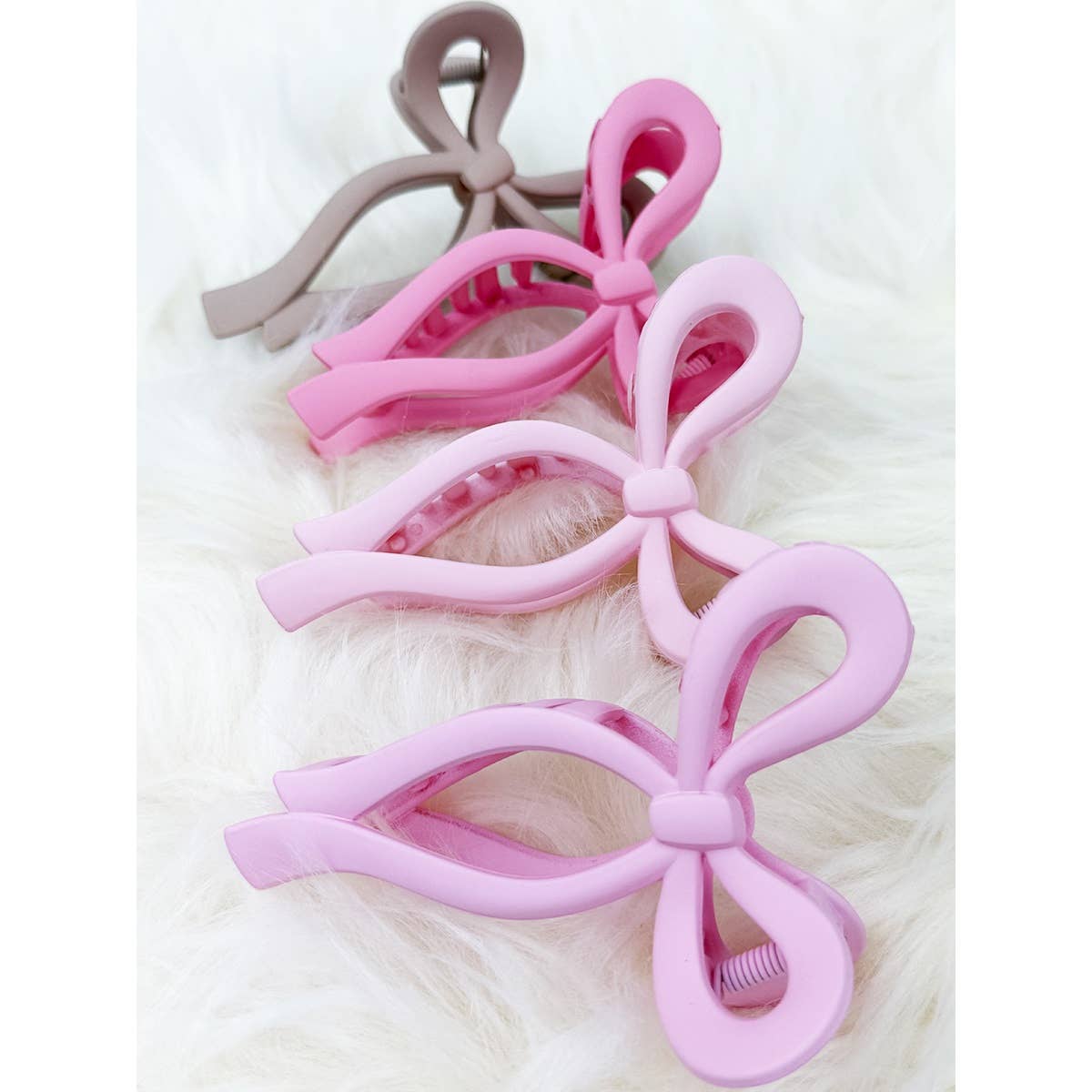 Assorted Pink and Taupe Shades of Bow Clip claw
