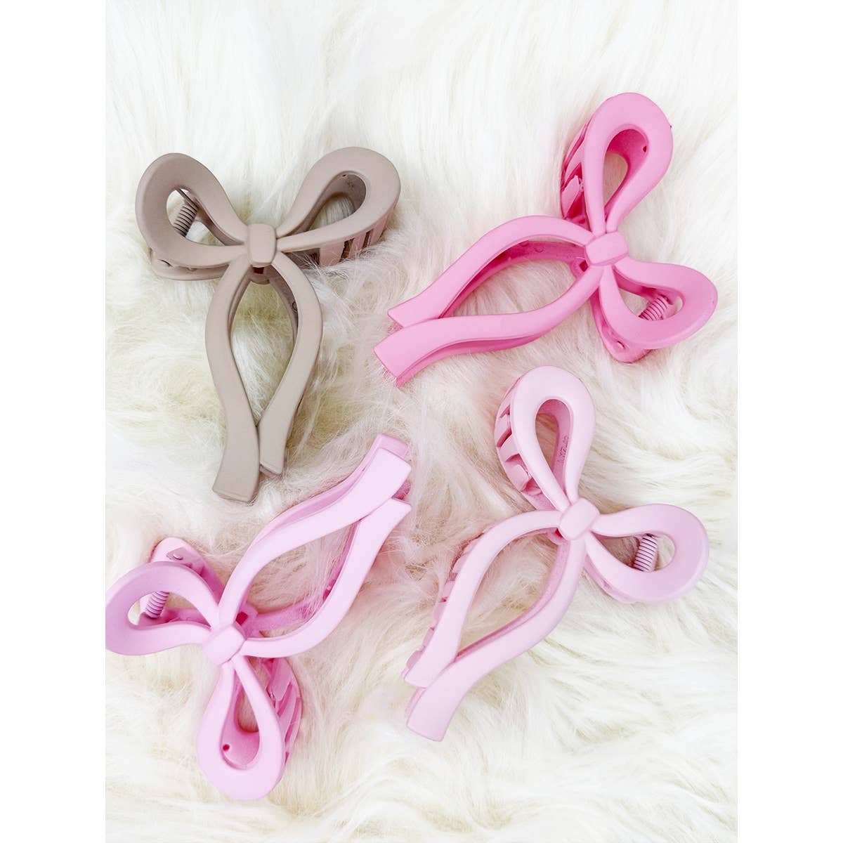 Assorted Pink and Taupe Shades of Bow Clip claw