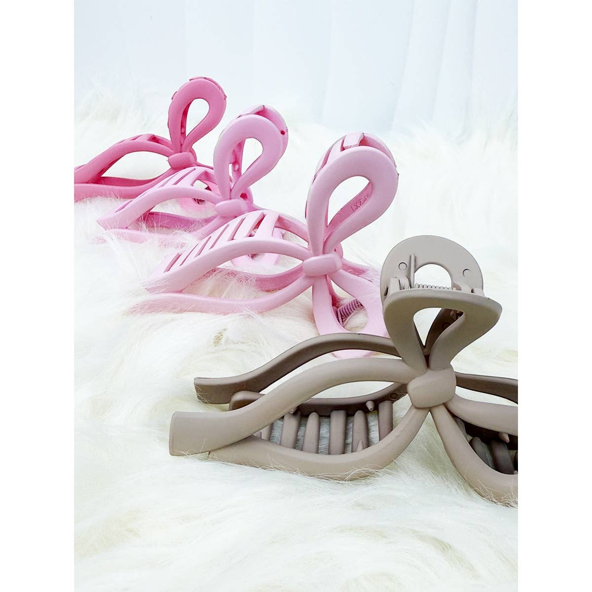 Assorted Pink and Taupe Shades of Bow Clip claw
