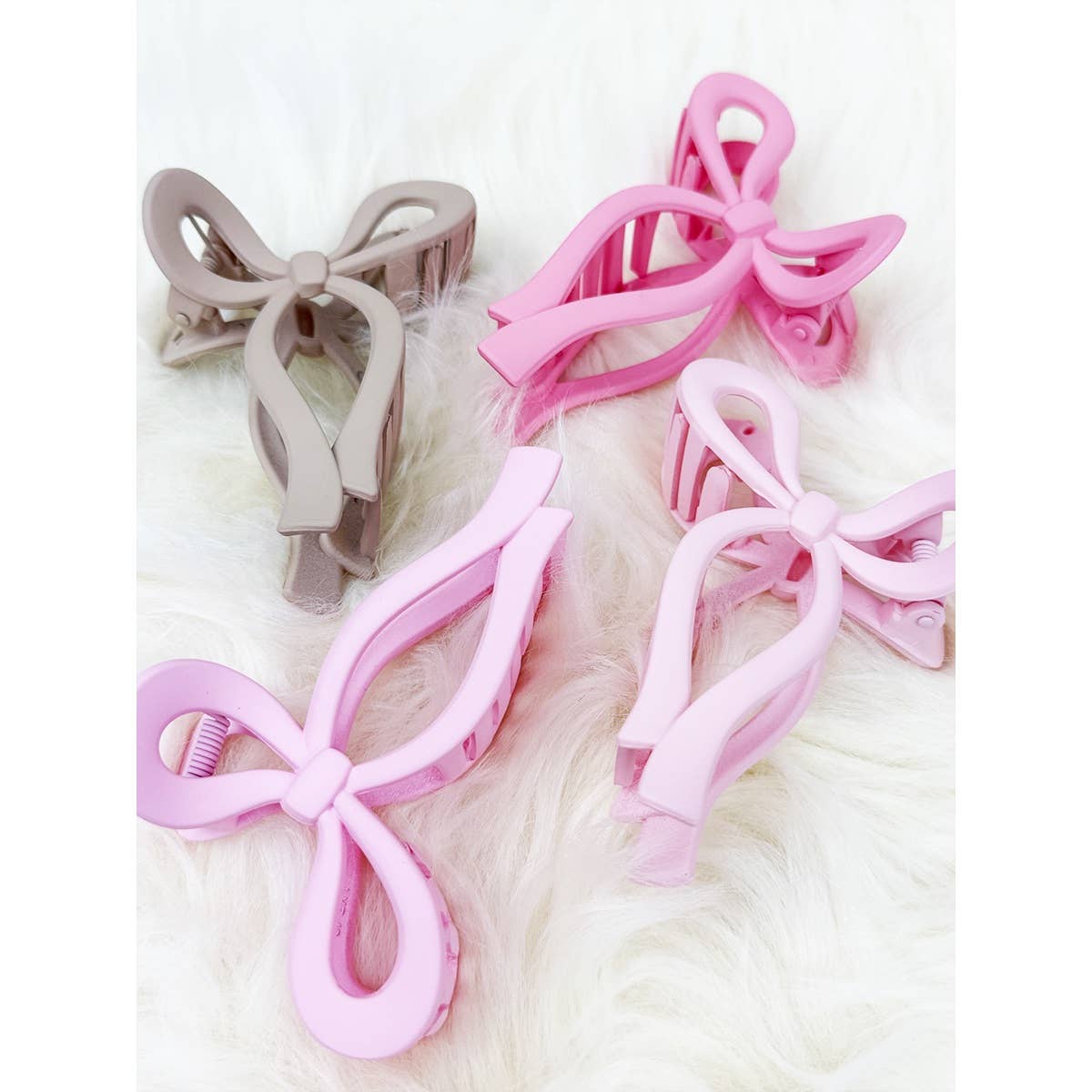 Assorted Pink and Taupe Shades of Bow Clip claw